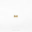 a gold bow tie on a white background