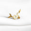 a close up of a piece of jewelry on a white surface