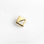 a square shaped gold pin with a triangle on it