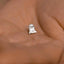 a person's hand with a tiny ring on it