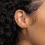 a close up of a woman's ear wearing a pair of earrings