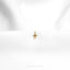 a small gold cross on a white cloth