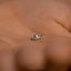 a close up of a person's hand with a ring on it