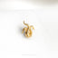 an octopus brooch sits on a white cloth