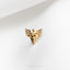 a gold pin with a medical symbol on it