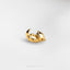 a close up of a gold ring on a white surface