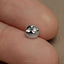 a close up of a person's finger with a ring on it