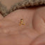 a close up of a person's hand with a gold ring on it