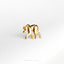 a gold brooch depicting a monkey on a white background