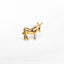 a gold horse brooch sitting on top of a white surface