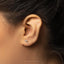 a close up of a person wearing a pair of ear piercings