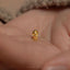 a close up of a person's hand with a gold ring on it