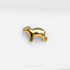 a gold pin with a dog on it