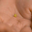 a tiny gold star on a person's hand