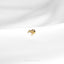 a close up of a gold ring on a white cloth