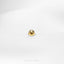 a close up of a gold ring on a white surface