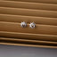 a pair of sun and moon stud earrings