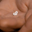 a close up of a person's hand holding a small white object