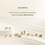 a white table topped with lots of gold rings