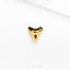 a close up of a gold plated object on a white surface