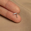 a person's finger with a small silver ring on it