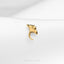 a close up of a gold ring on a white cloth