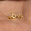 a close up of a person's hand with a gold nose ring