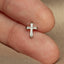 a close up of a person's finger with a cross on it