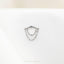 a silver ring with a chain hanging from it