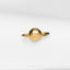 a gold ring with a planet on it