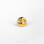 a gold skull ring on a white surface