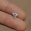 a person's hand with a ring on it