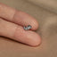a person's hand with a ring on it