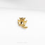 a gold pin with a bat on it