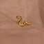 a close up of a person's ear with a gold earring
