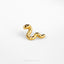 a pair of gold ear studs on a white surface