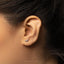 a close up of a person wearing a pair of ear piercings