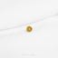 a gold ring sitting on top of a white sheet