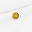 a close up of a gold ring on a white surface