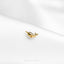 a close up of a gold ring on a white cloth