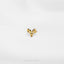 a close up of a gold brooch on a white background