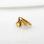 a close up of a gold ring on a white surface