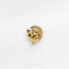 a gold brooch depicting a peacock on a white background