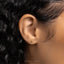 a close up of a person's ear and earring
