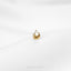 a gold earring with a cat's head on it