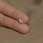 a person wearing a ring with a horse on it
