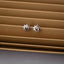 a pair of sun and moon stud earrings
