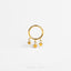 a gold ring with stars hanging from it