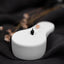 a close up of a white object on a black cloth