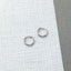 Minimalist hoop earrings – flat-lay silver